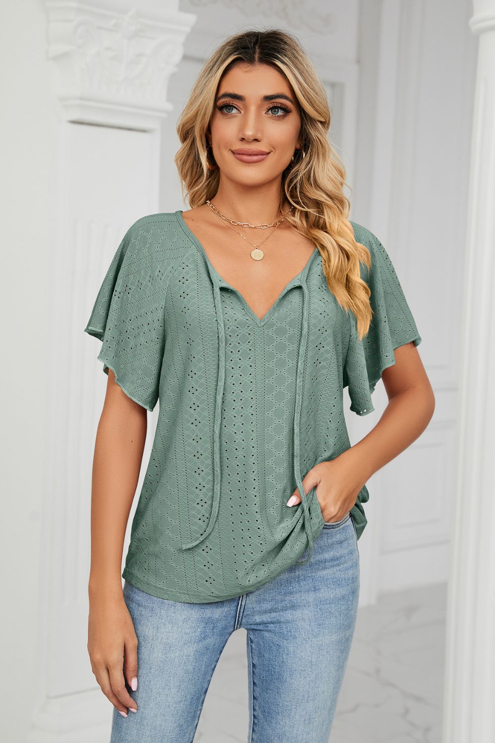 Green eyelet blouse front view on model