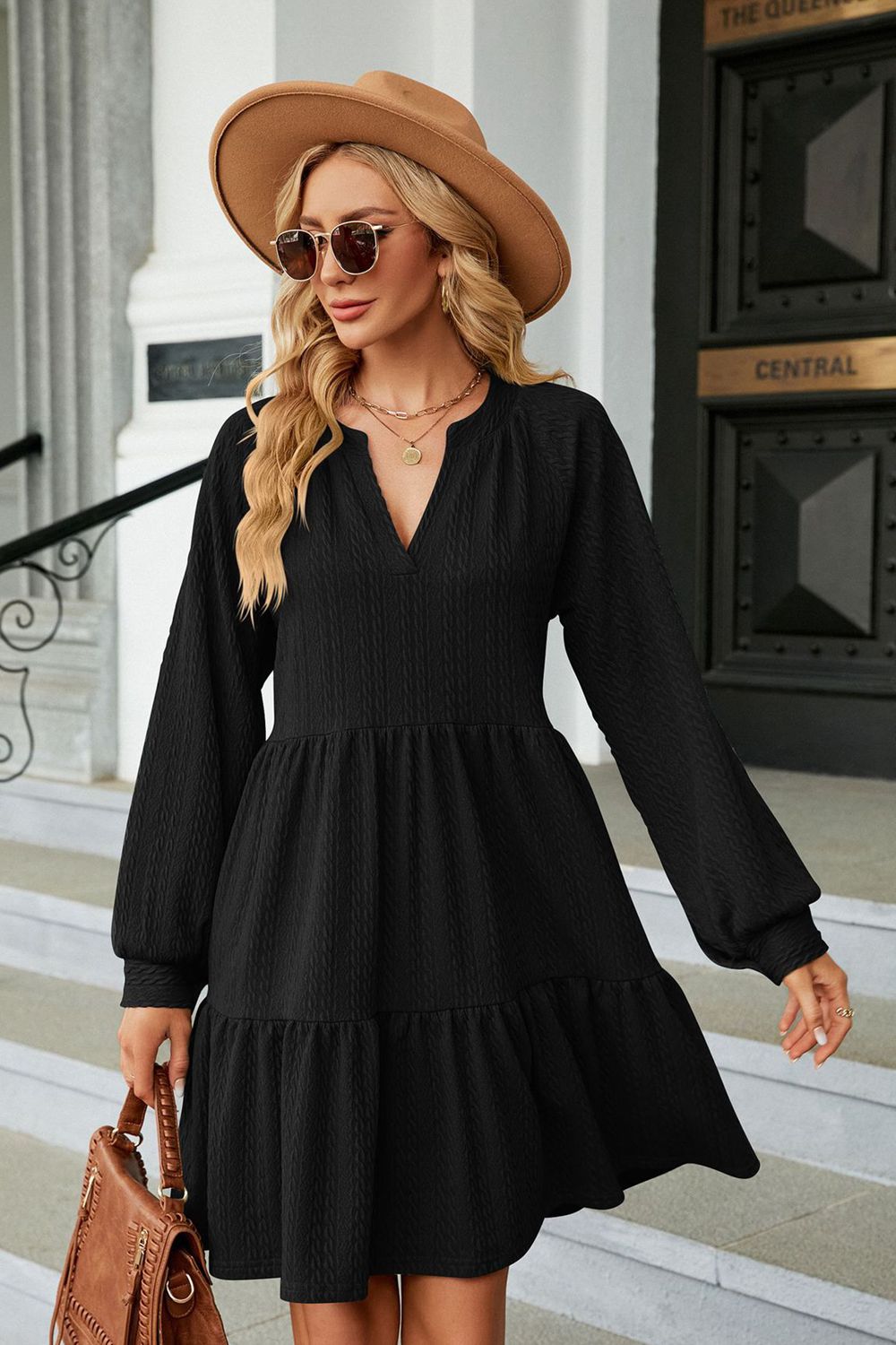 Black notched neck long sleeve mini dress on model