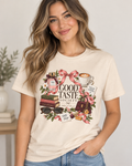 Good Taste Society women’s graphic tee with coffee, books, bows, florals, perfume and fashion-inspired artwork