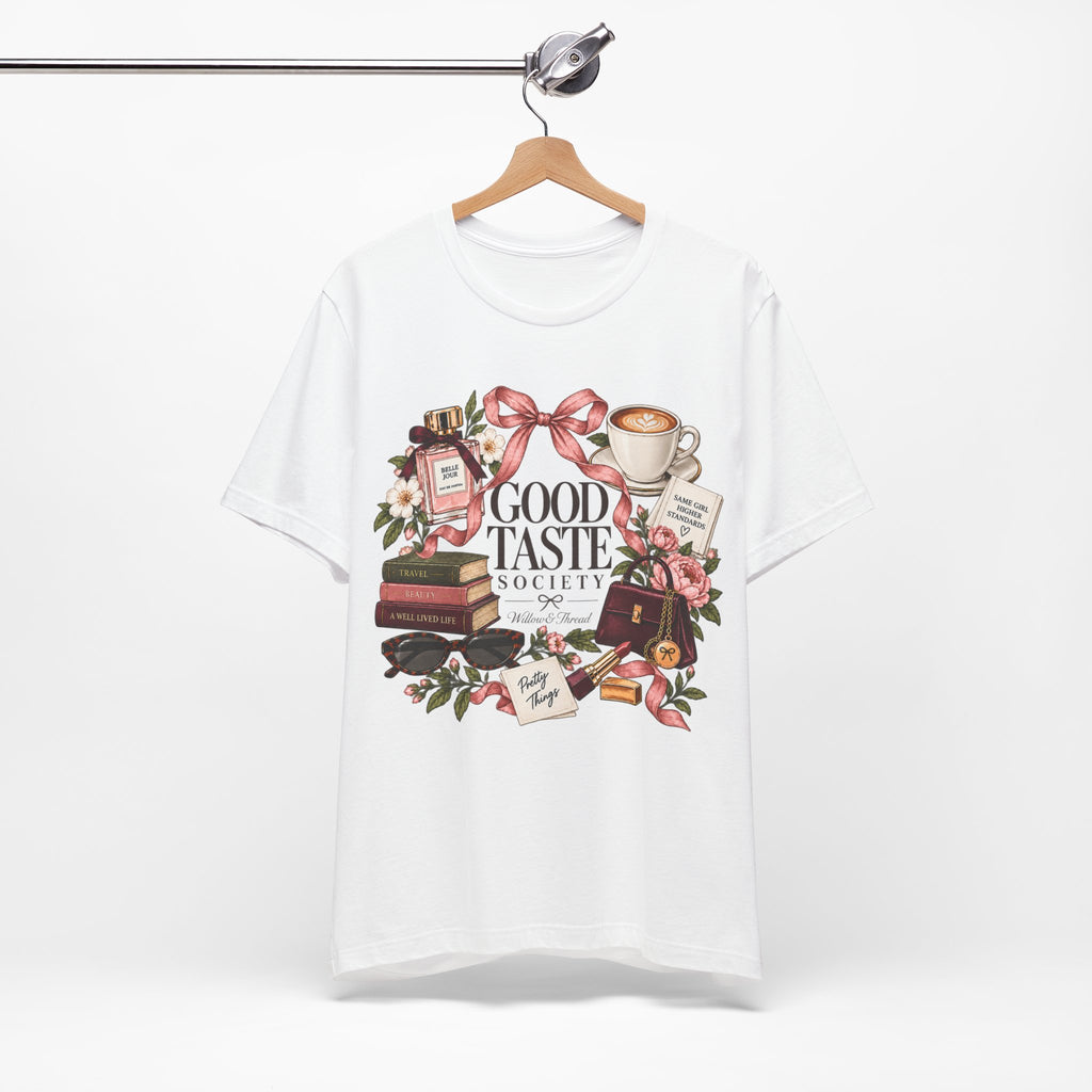 Women’s Good Taste Society graphic tee with detailed coffee, books, florals, bows and fashion illustration