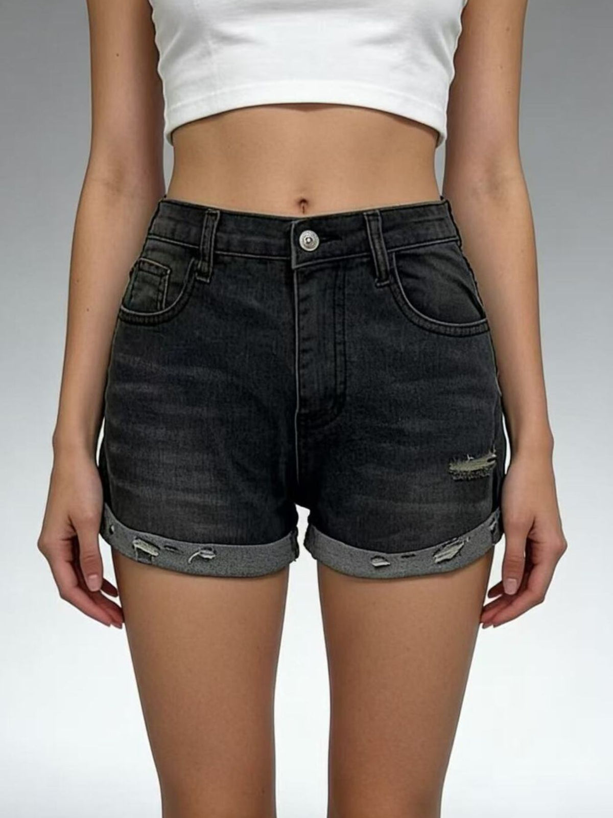 Women’s distressed denim roll-up shorts on model, image 2