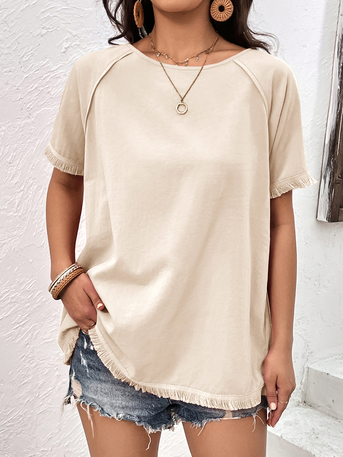 Cream fringe trim raglan sleeve top front view on model