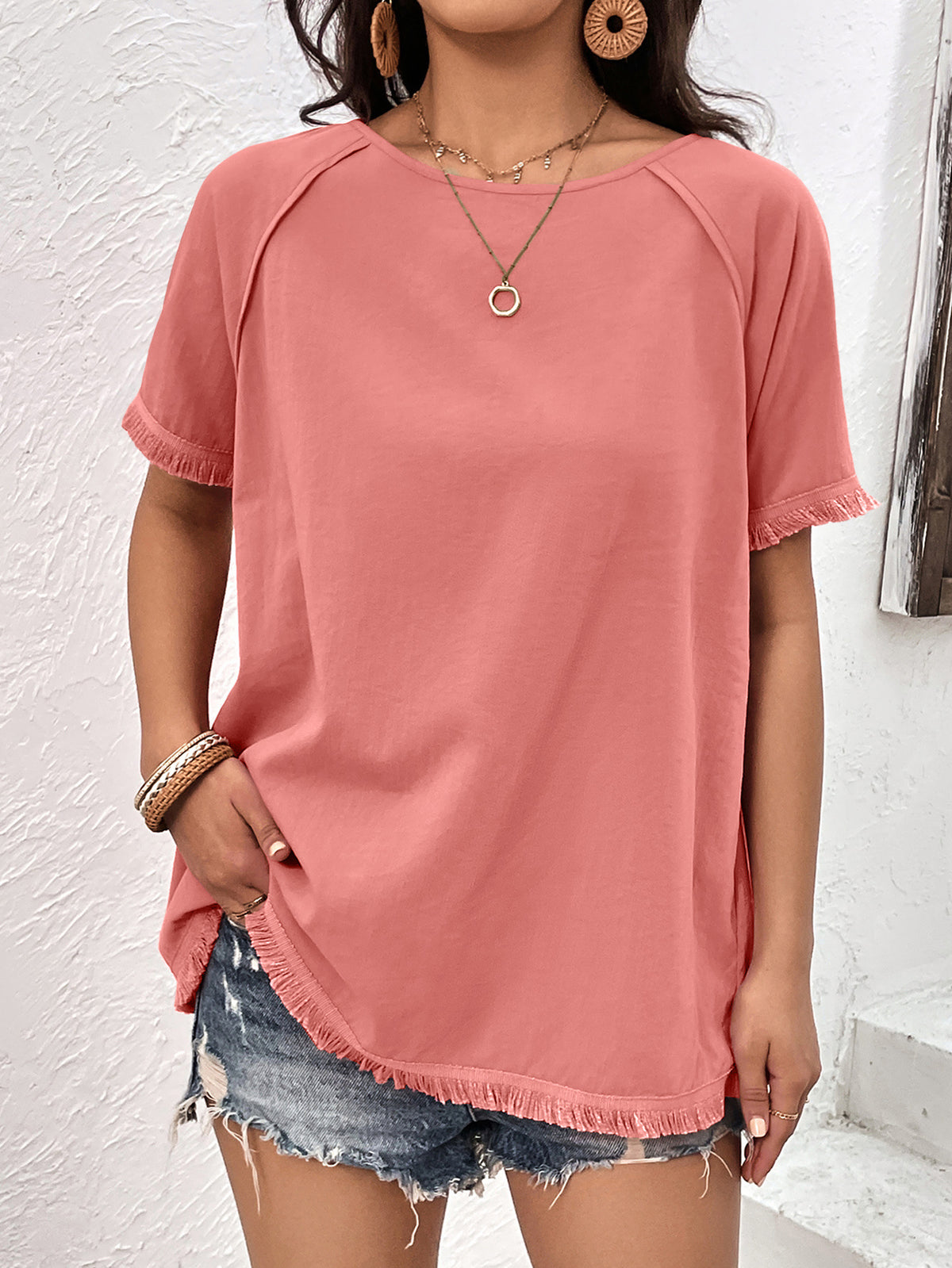 Coral fringe trim raglan sleeve top front view on model