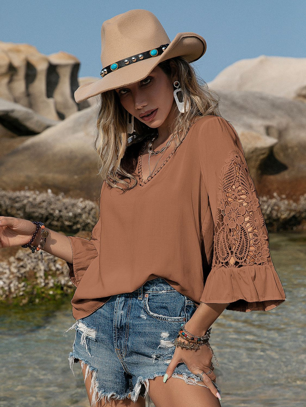 Chestnut openwork blouse side view with flounce sleeve detail