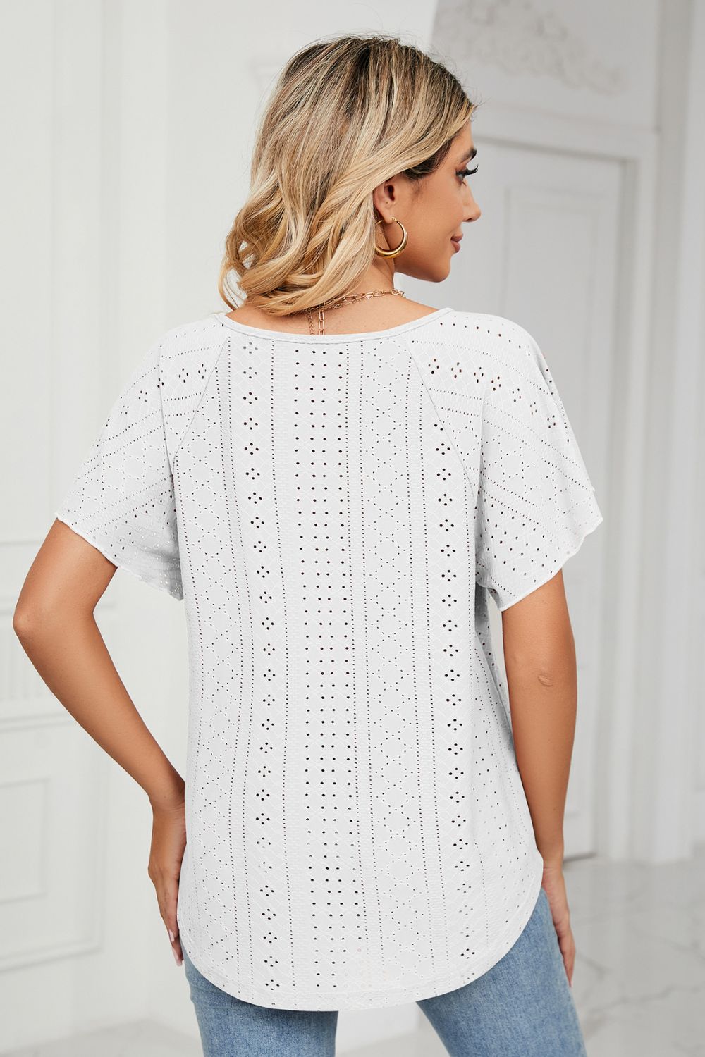 White eyelet blouse back view with flutter sleeves