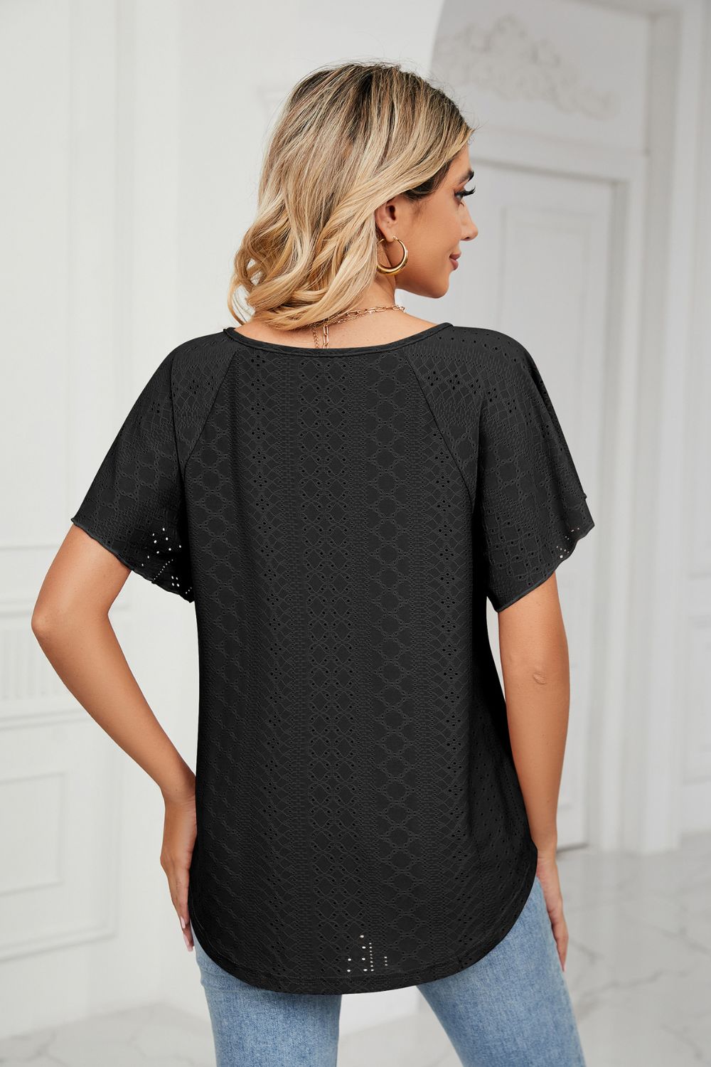 Black eyelet blouse back view with flutter sleeves