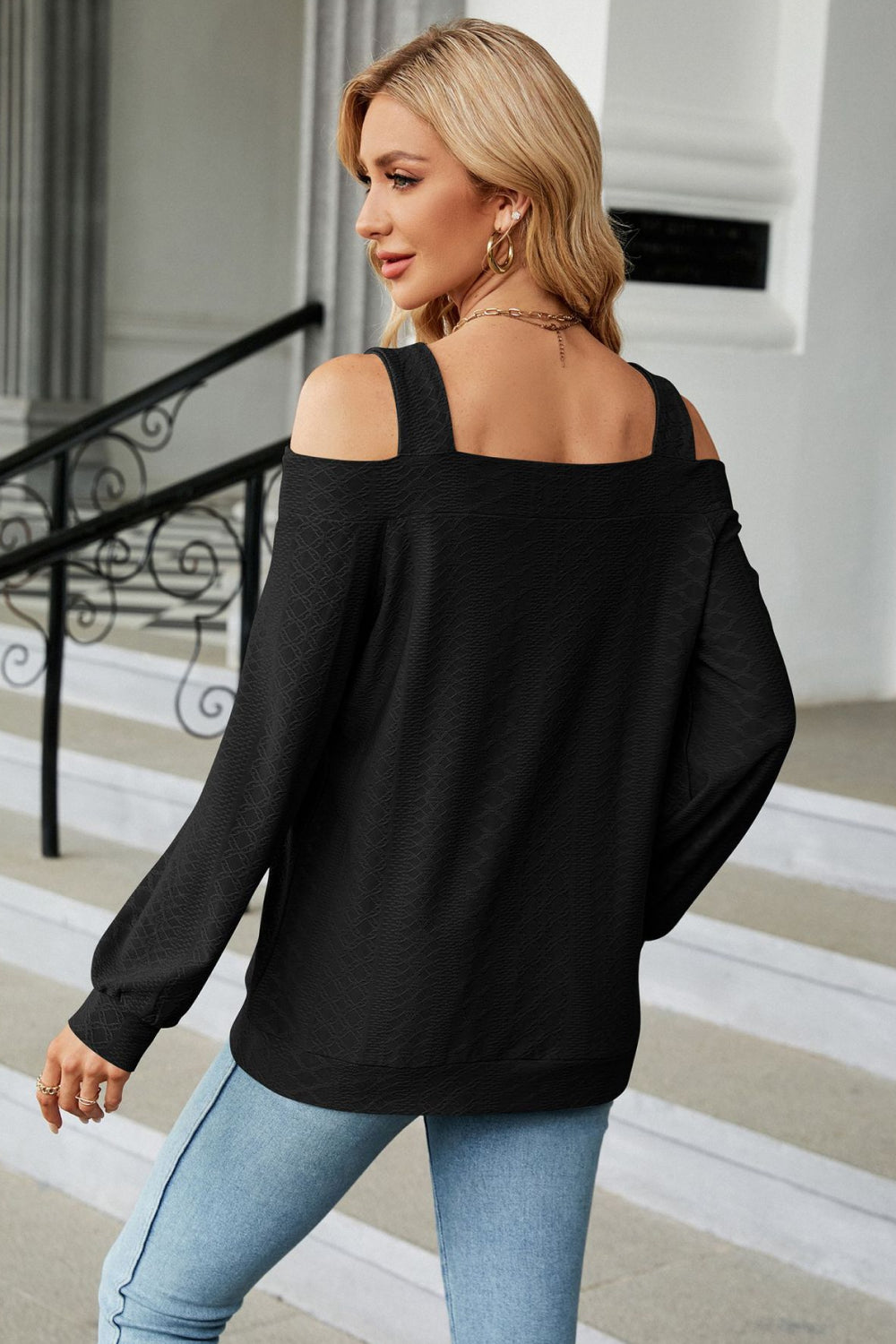 Square neck blouse with shoulder cutouts on model