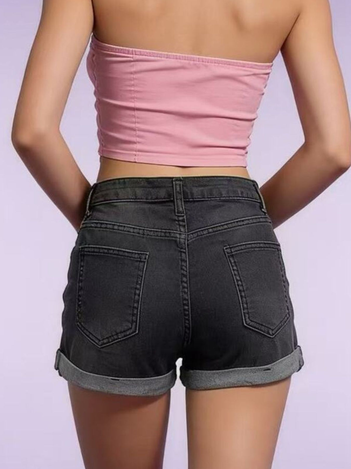 Women’s distressed denim roll-up shorts on model, image 5