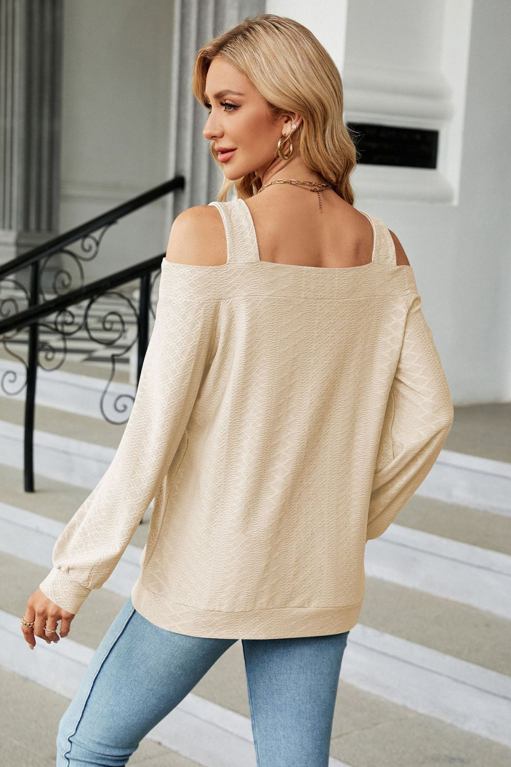 Square neck blouse with shoulder cutouts on model