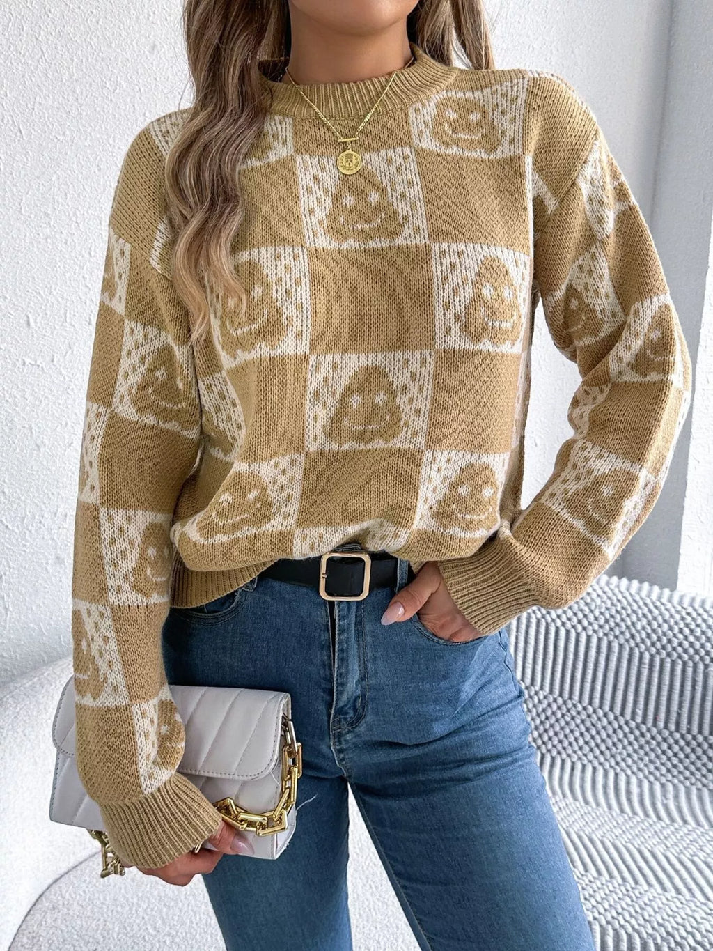 Women’s beige cat sweater with playful checkerboard pattern