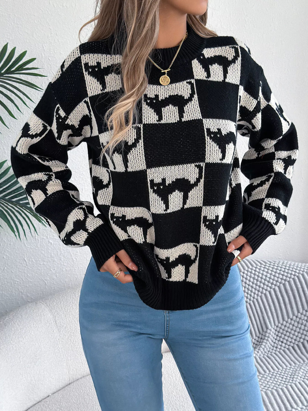 Black checkerboard cat sweater front view