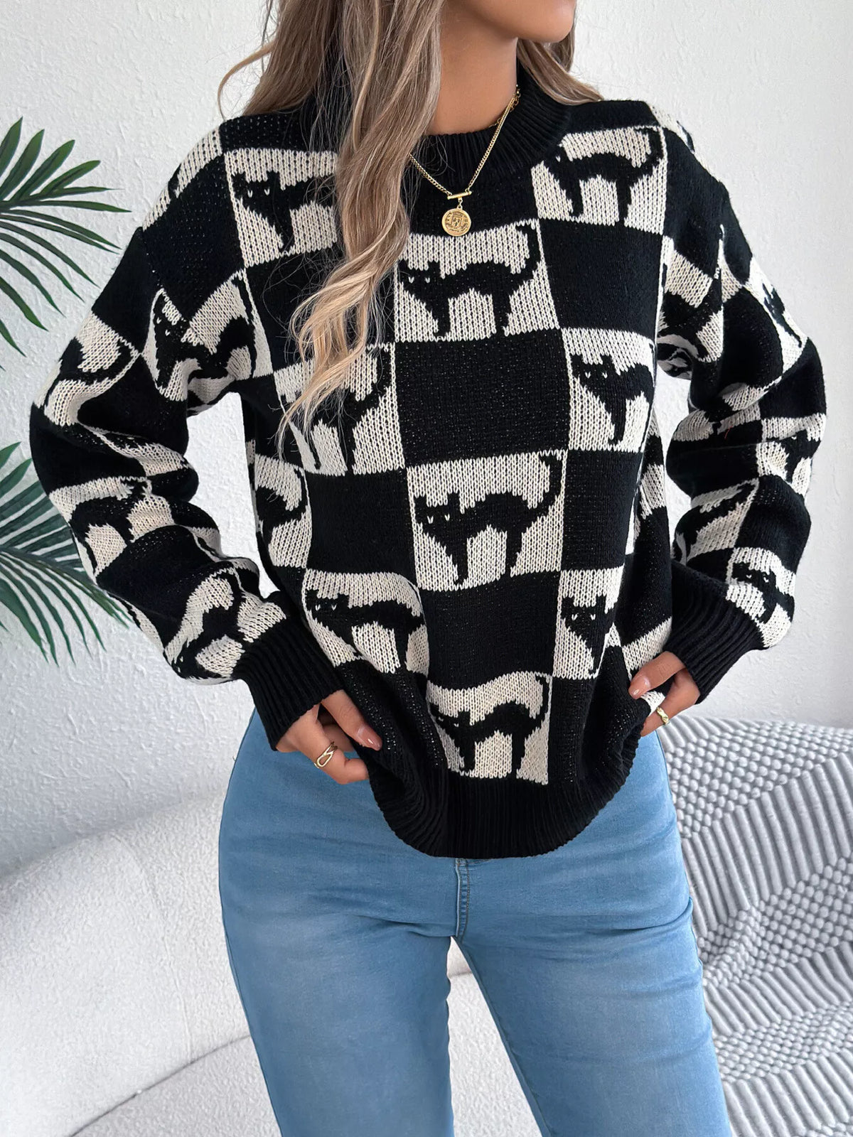 Black checkerboard cat sweater front view