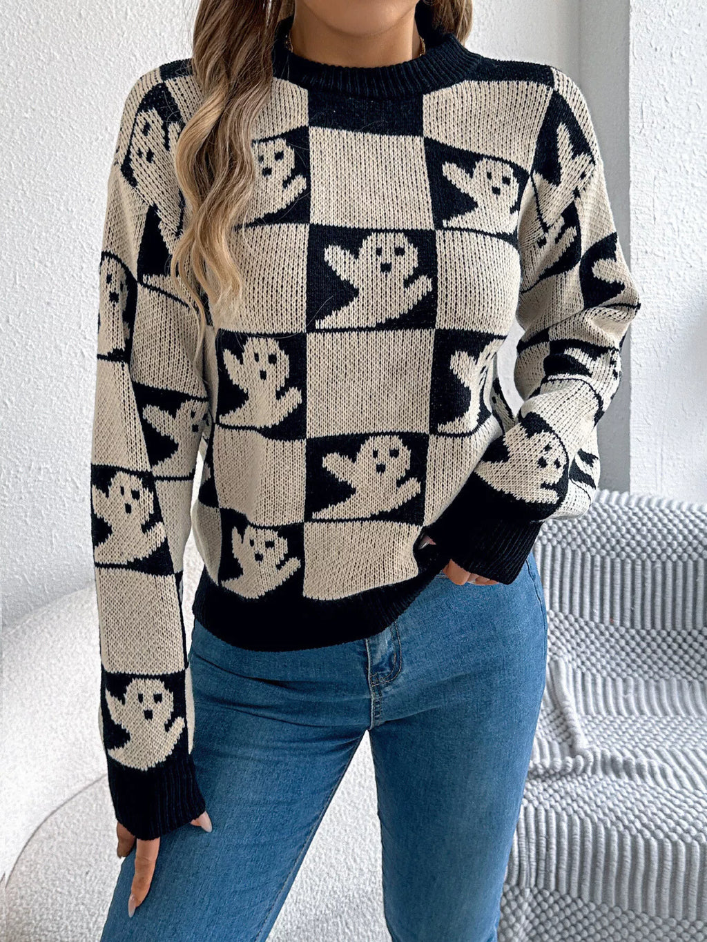 Women’s black Halloween cat sweater with checkerboard pattern