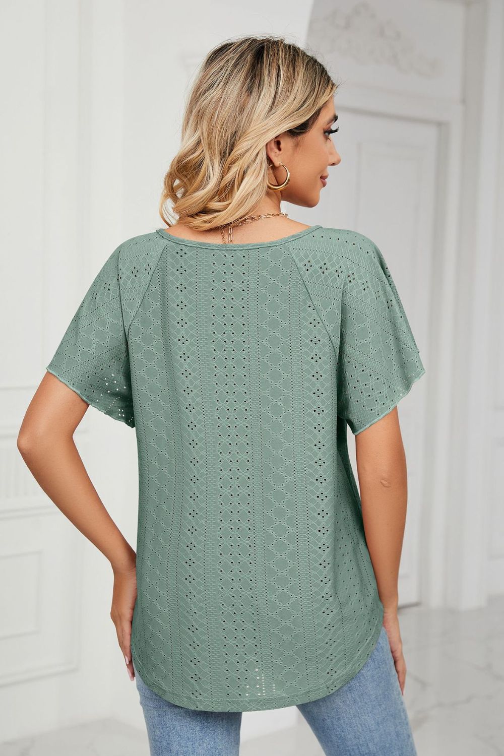 Green eyelet blouse back view with flutter sleeves
