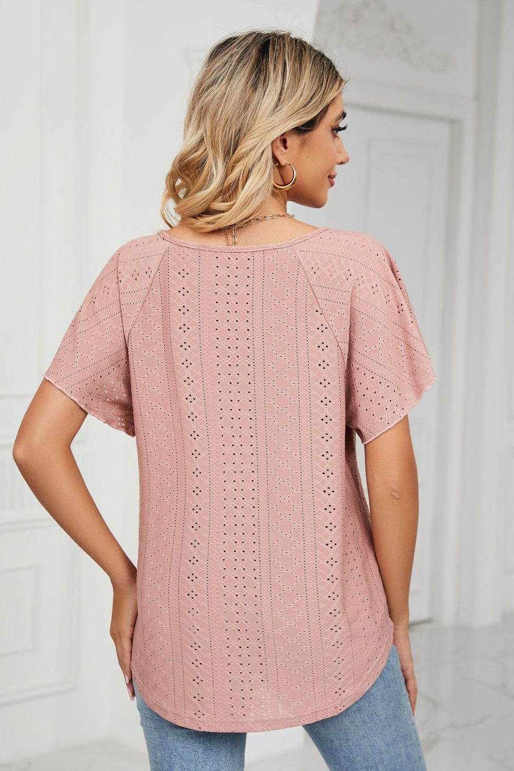 Pink eyelet blouse back view with flutter sleeves