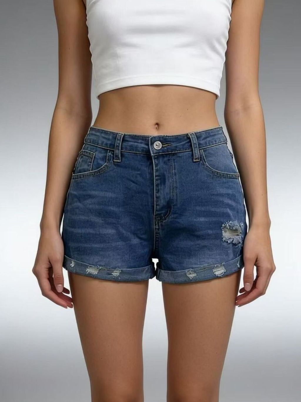 Women’s distressed denim roll-up shorts on model, image 9