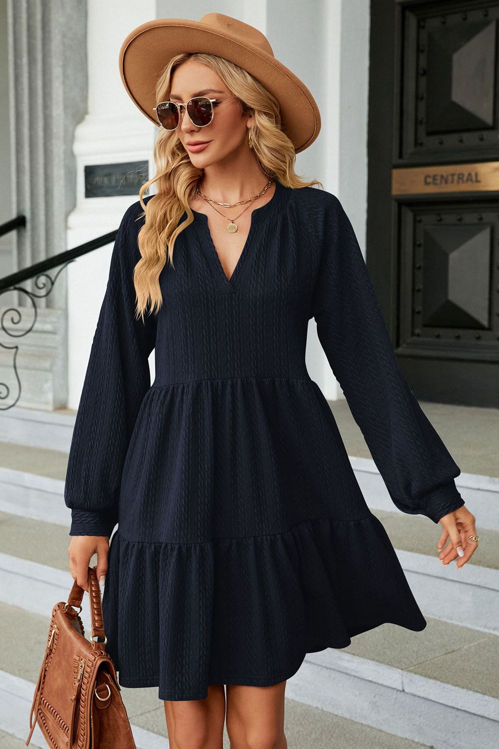 Dark blue notched neck long sleeve mini dress on model