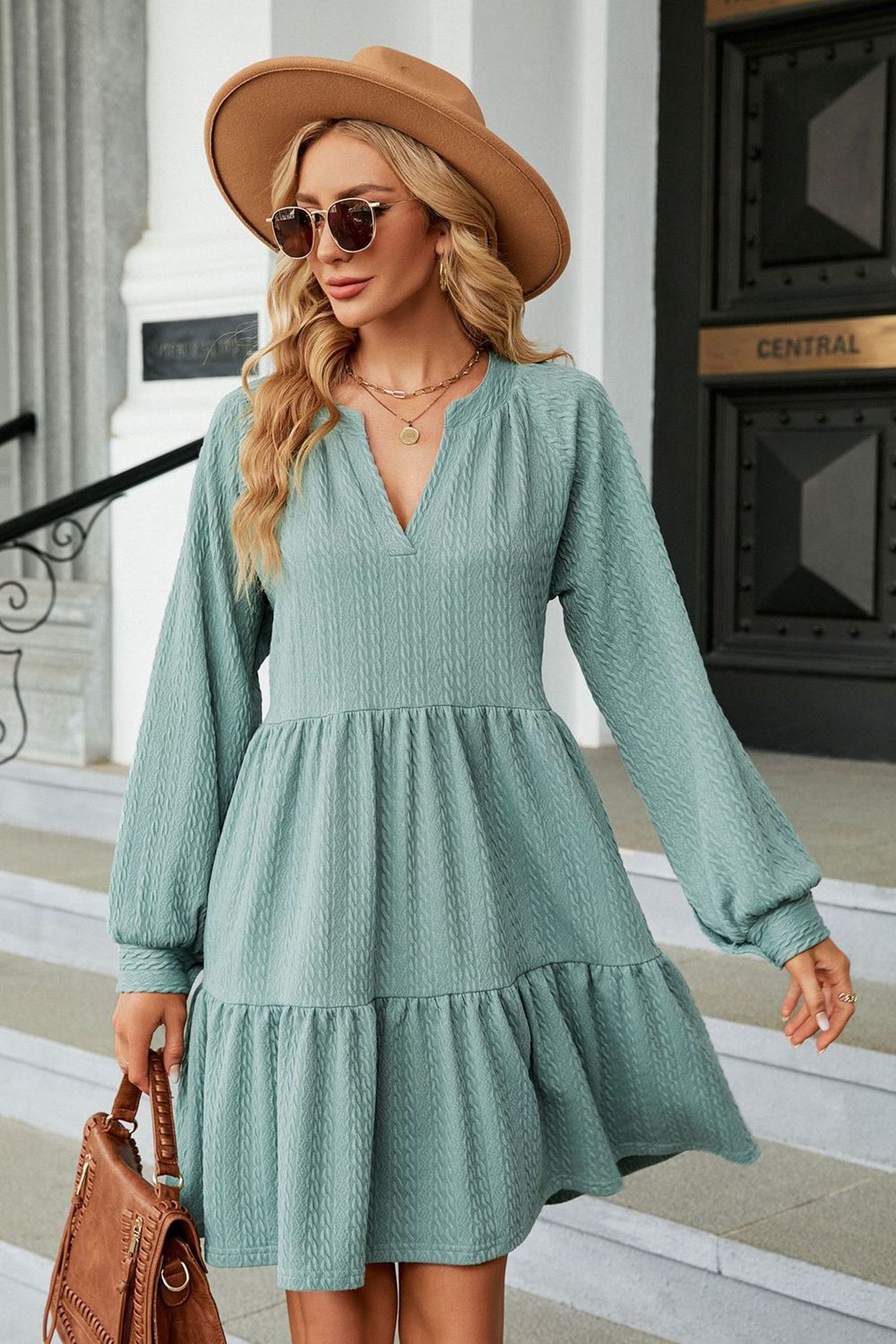 Light green notched neck long sleeve mini dress on model
