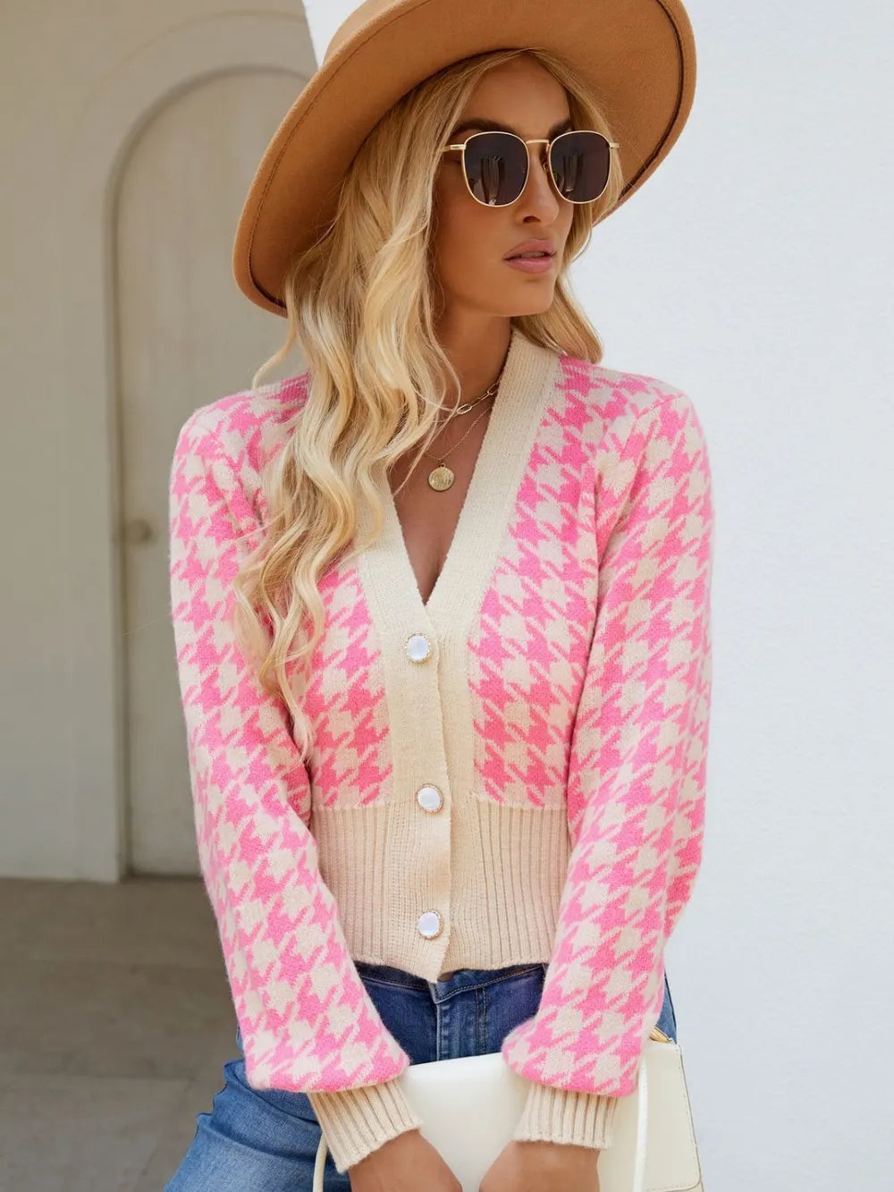 Pink houndstooth button-up long sleeve cardigan on model