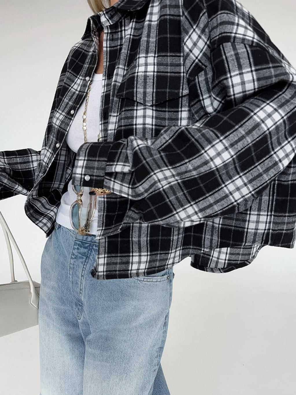 Black and white plaid button-up shirt with oversized fit