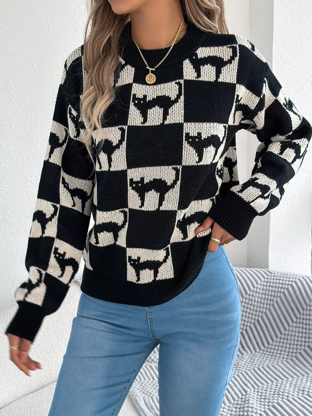 Women’s checkerboard cat sweater fall outfit styling