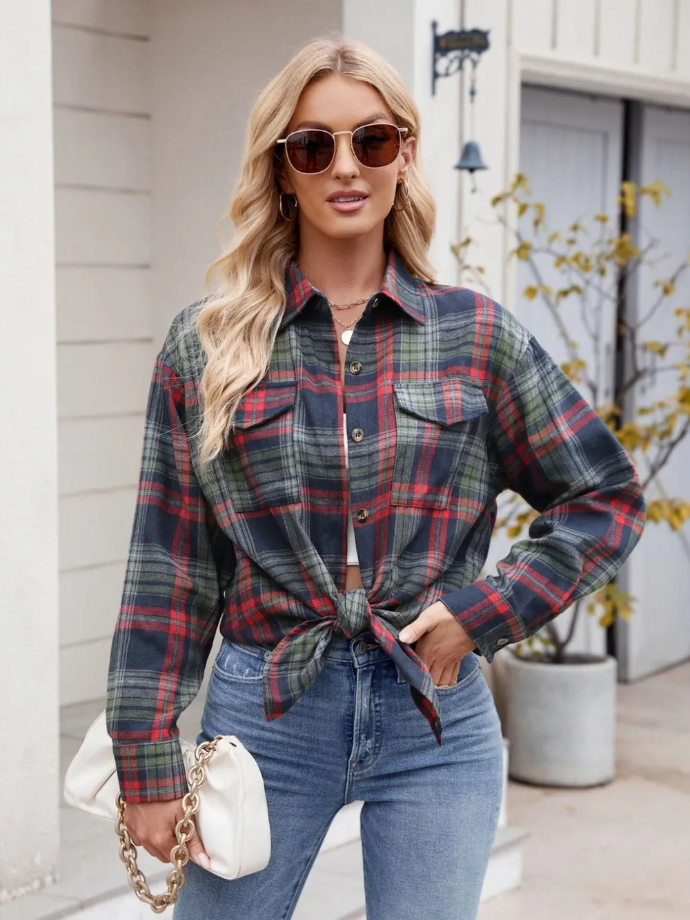 Women's plaid button-up shirt styled with denim