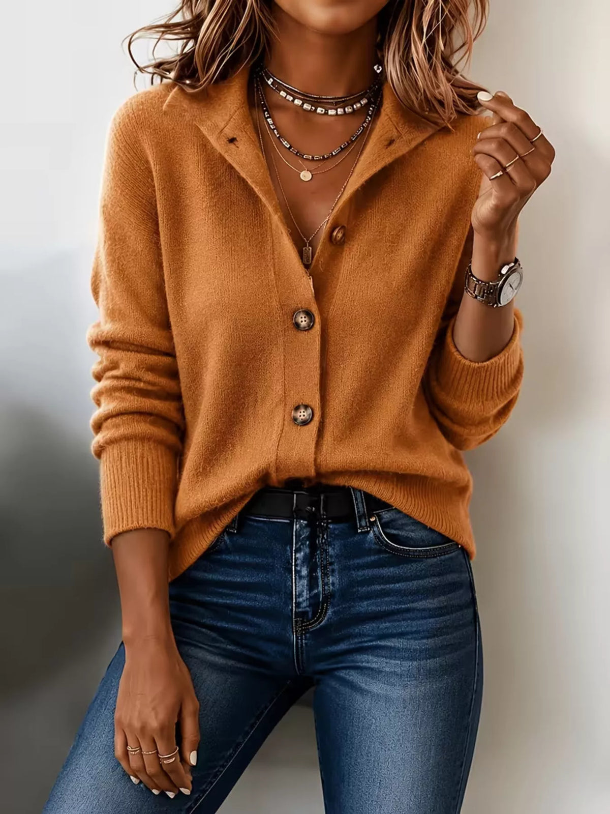 Women’s tangerine button-down knit cardigan showing button-front knit design